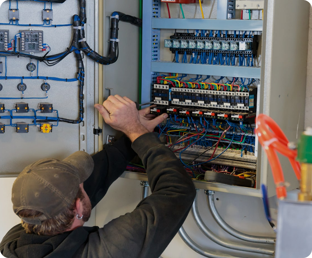 Electrician working on panel